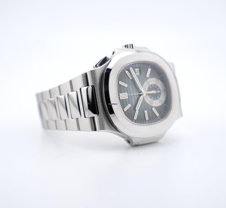 Patek Philippe Nautilus Chronograph Black Dial With White Gold Indexes - With Extract From The Archives