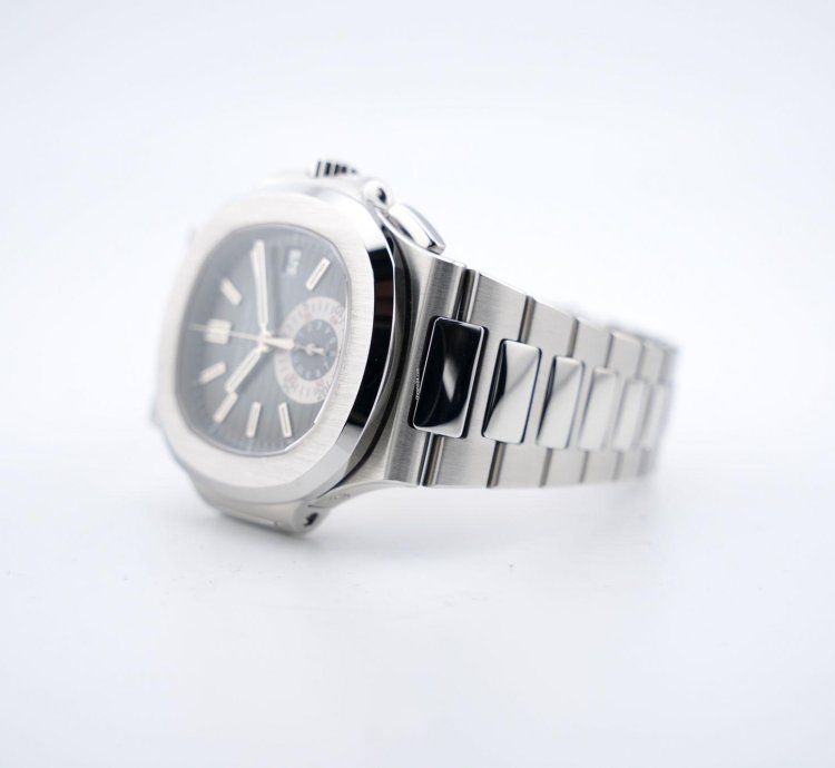 Patek Philippe Nautilus Chronograph Black Dial With White Gold Indexes - With Extract From The Archives