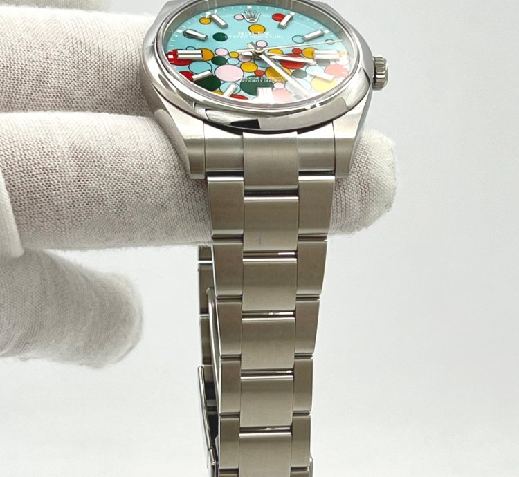 Rolex Oyster Perpetual 41 Turquoise Blue Celebration Motif Index Dial