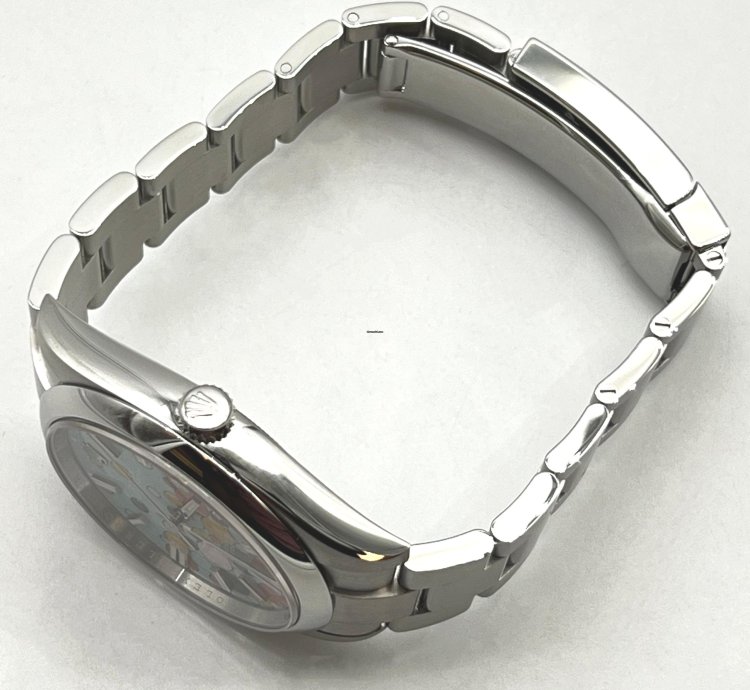 Rolex Oyster Perpetual 41 Turquoise Blue Celebration Motif Index Dial