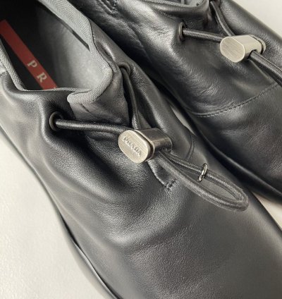 1999 Bunjee Cord Leather Sneakers