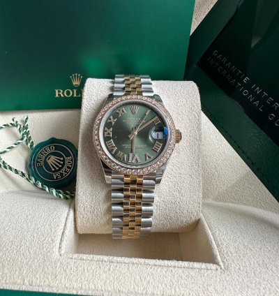 Rolex Datejust 31 2023 Two Tone Yellow Gold Green Roman Dial Diamond Bezel - Jubilee Bracelet