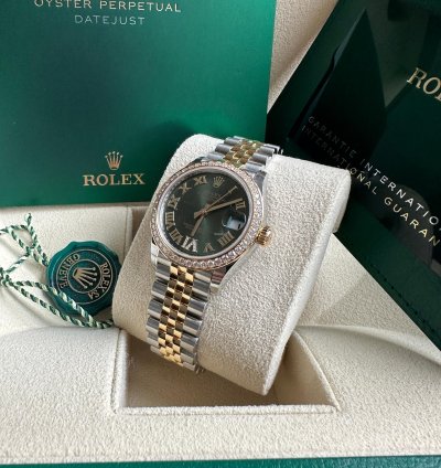 Rolex Datejust 31 2023 Two Tone Yellow Gold Green Roman Dial Diamond Bezel - Jubilee Bracelet