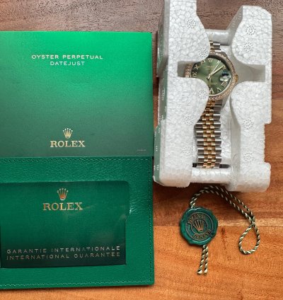 Rolex Datejust 31 2023 Two Tone Yellow Gold Green Roman Dial Diamond Bezel - Jubilee Bracelet