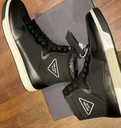 Prada High Top Leather And Nylon Sneakers