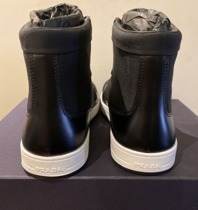 Prada High Top Leather And Nylon Sneakers