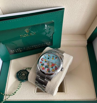 Rolex Oyster Perpetual 41 Bubble Celebration Dial New