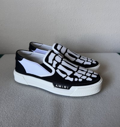 Amiri Skel Top Slip Ons In White Black