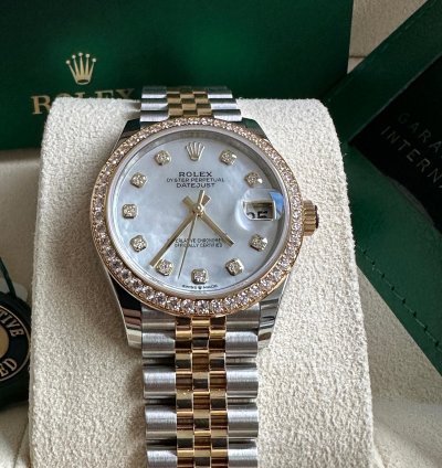 Rolex Datejust 31 2023 Two Tone Yellow Gold Mother Of Pearl Dial Fluted Bezel Jubilee Bracelet