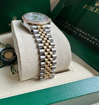 Rolex Datejust 31 2023 Two Tone Yellow Gold Mother Of Pearl Dial Fluted Bezel Jubilee Bracelet