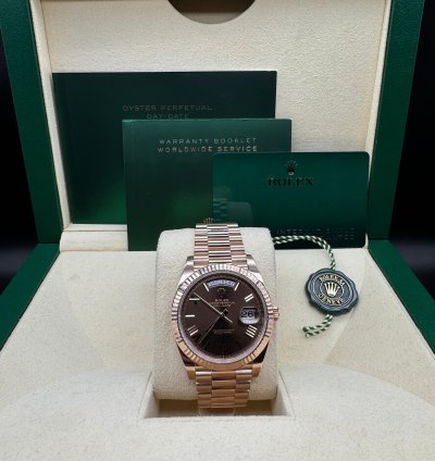 Rolex Day-date 40 Chocolate Roman Dial Unworn