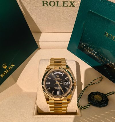Rolex Day-date 40 Yellow Gold Black Baguette Dial