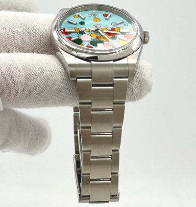 Rolex Oyster Perpetual 41 Turquoise Blue Celebration Motif Index Dial