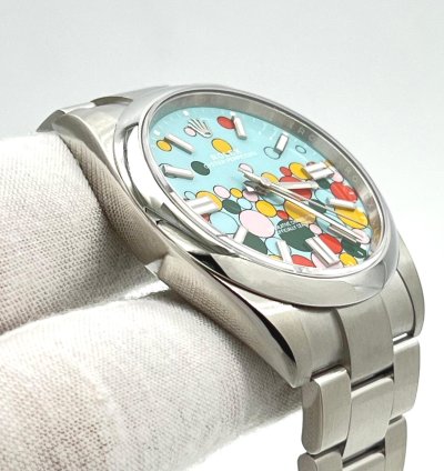 Rolex Oyster Perpetual 41 Turquoise Blue Celebration Motif Index Dial