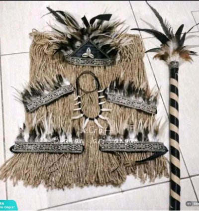 A Set Of Traditional Papuan Interior Costumes With Sticks For Children And Adults